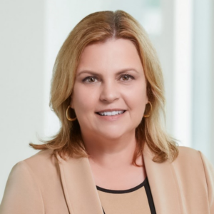 jodi younger has shoulder lenght blond hair and is wearing a being blazer
