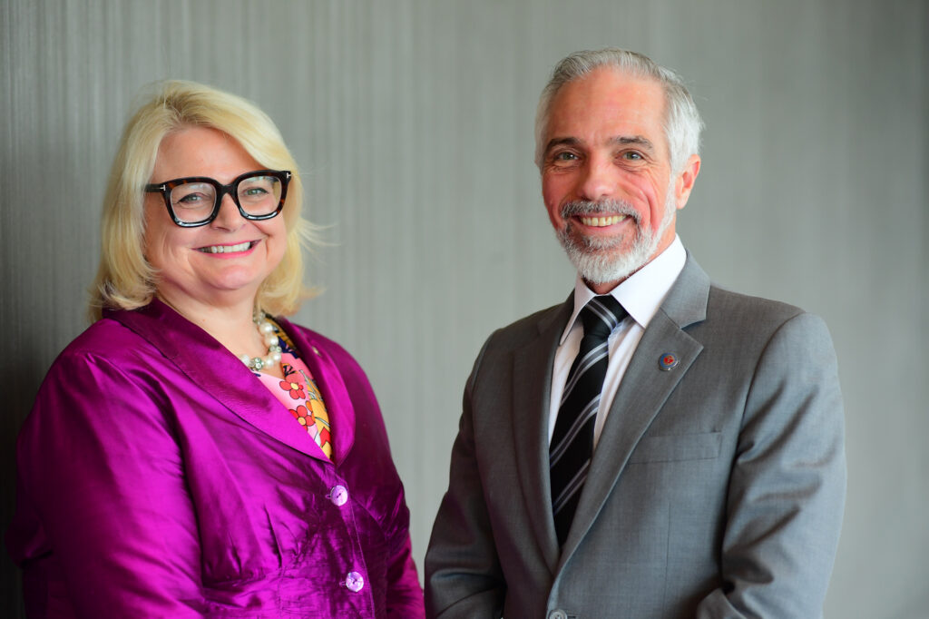 Sue Owen (left) and Marc Bilodeau (right) posing for a photo